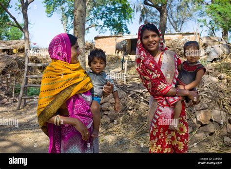 Indian villagers by farm smallholding near Ranthambore in Rajasthan ...