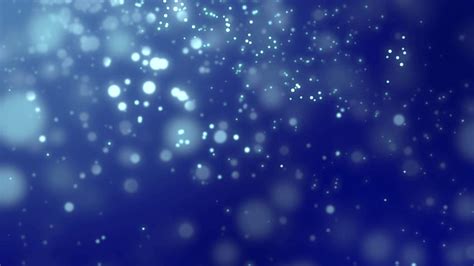 White luminous particles falling against dark blue backgrounds Motion ...