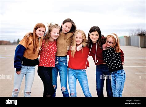 Group of 6 cute Tween girls hanging out having fun in the city Stock ...