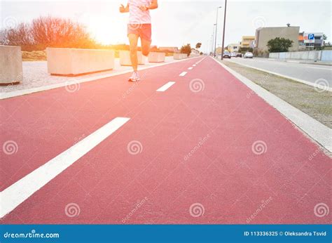 Red Running Track at Sunset. Running Man Stock Image - Image of human ...