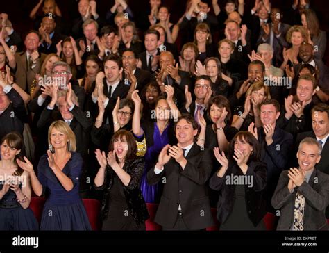 Clapping theater audience Stock Photo - Alamy