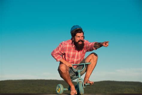 Premium Photo | Funny man on a bicycle. emotional crazy guy on a childrens bike.