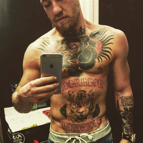 Conor McGregor's tattoo showing “MCGREGOR” and “NOTORIOUS” on the upper ...