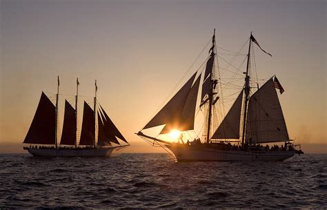 Tall Ships At Sunset Photograph by Cliff Wassmann