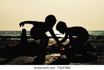 Silhouette Children Playing On Sunset Beach Stock Photo 776257882 | Shutterstock