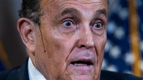 Hair dye runs down Rudy Giuliani's face during news conference