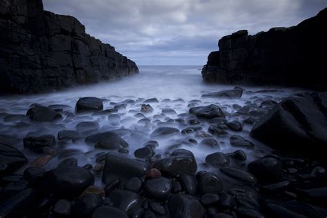 Black rocks one sea shore under white clouds HD wallpaper | Wallpaper Flare