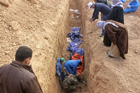 Dozens of bodies 'found in Islamic State mass grave' in Iraq | Middle ...