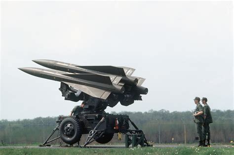 US Army soldiers inspect MIM-23B Hawk missiles on a towed launcher - PICRYL Public Domain Search