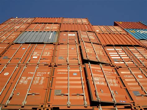 Royalty-Free photo: Low angle photo of orange intermodal container ...