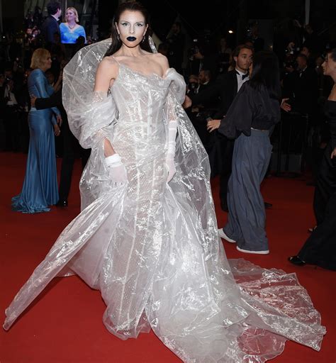 Julia Fox hits 2023 Cannes Film Festival red carpet in plastic poncho gown