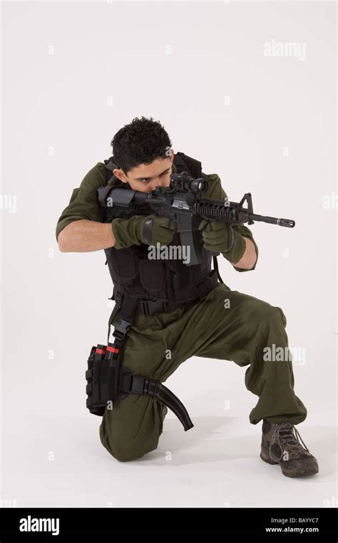 SAS Soldier in crouching shooting position Stock Photo - Alamy