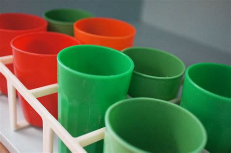 Cups in a bottle rack | Independent play setups for babies a… | Flickr