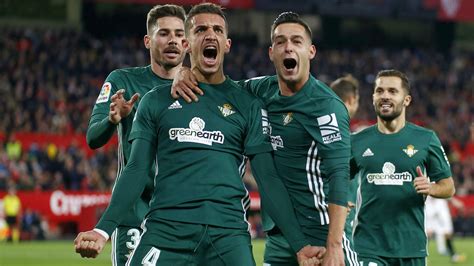 Real Betis players celebrate as they beat Sevilla 5-3 in the Andalucian ...