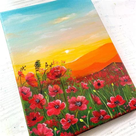 an acrylic painting of red poppies in a field with the sun setting