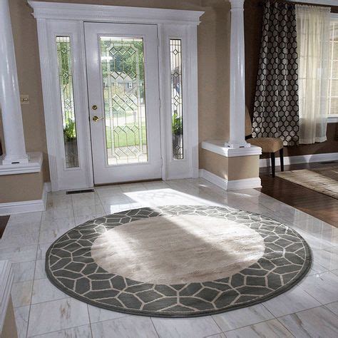 Don’t be afraid to use shapes other than rectangle for your area rug. Round rugs are great for ...