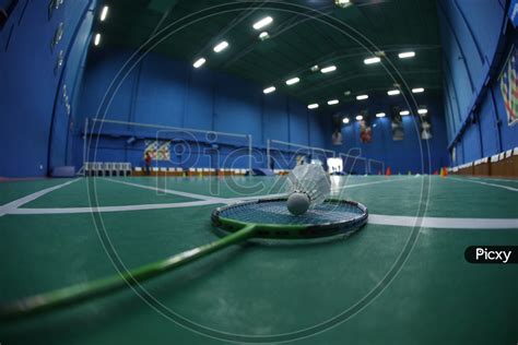 Image of Shuttle And Badminton Bat in A Shuttle Badminton Indoor Synthetic Court-ZJ234895-Picxy