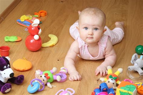 Baby playing with a toys stock image. Image of care, laugh - 7241489