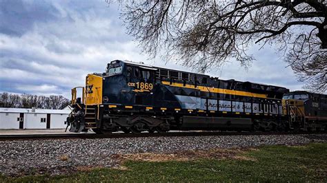 CSX 1869 C&O Heritage Unit and a Train Hauling Track Panels - YouTube