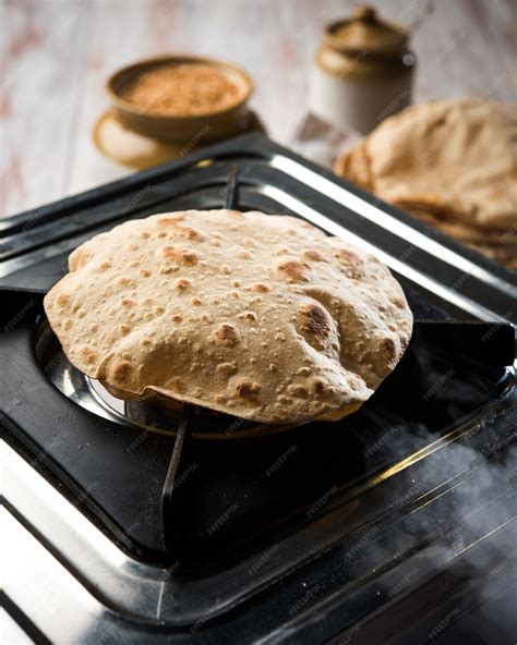 Premium Photo | Indian chapati or fulka or gehu roti with wheat grains ...