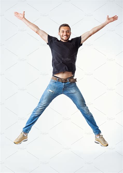 Happy excited man jumping | High-Quality People Images ~ Creative Market