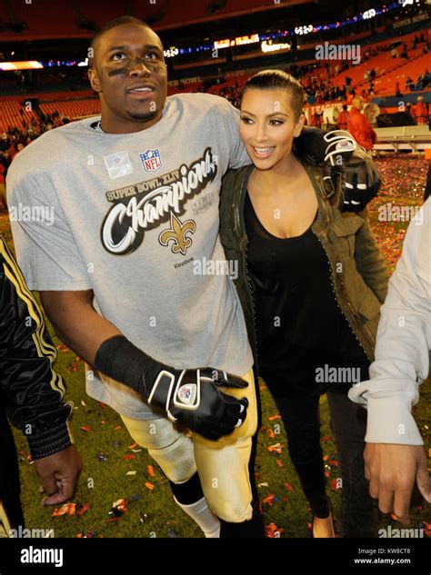 MIAMI GARDENS, FL - FEBRUARY 07: Kim Kardashian, Reggie Bush at Super ...