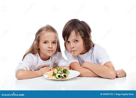 Kids eating spaghetti stock image. Image of dish, hungry - 40092193