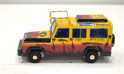 African Safari Recycled Red Tin Truck Pop Up Roof Tanzania Toy Safari Truck