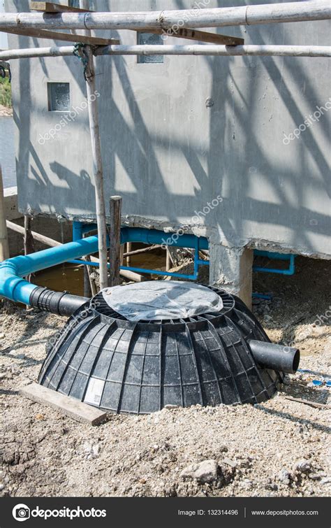 Waste treatment tank or septic tank installation in construction site — Stock Photo © yaryhee ...