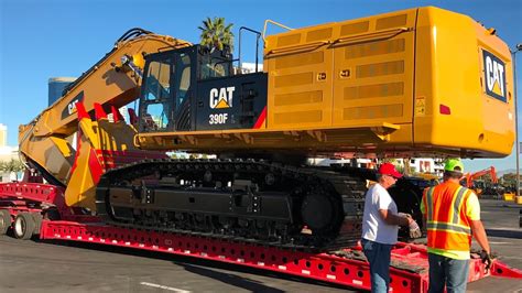 Moving the massive Cat 390F excavator from Conexpo - YouTube