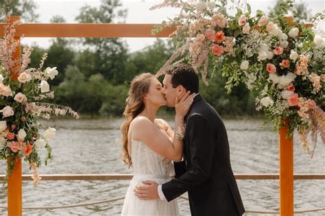 Premium Photo | The bride and groom kiss