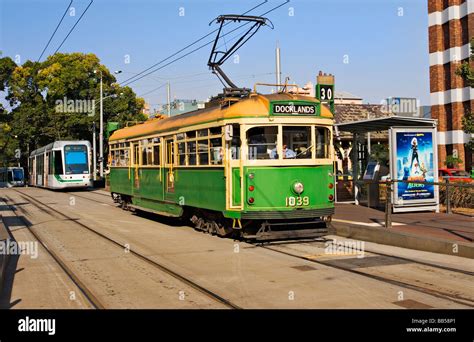 Melbourne Australia / A vintage Melbourne tram is stationary at a tram stop in Melbourne ...