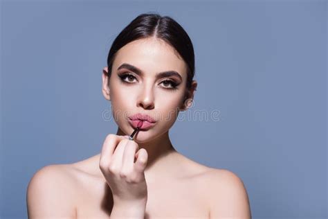 Gorgeous Young Woman in Stylish Makeup. Girl Posing with New Lipstick in Studio. Girl Rouging ...