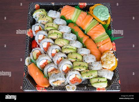 Sushi Party Platter with fresh raw smoked salmon California Caterpillar rolls Nigiri Wasabi ...