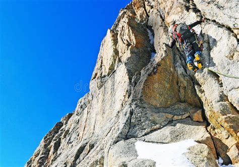 Climber Reaches the Top of Mountain Peak. Climbing and Mountaineering ...