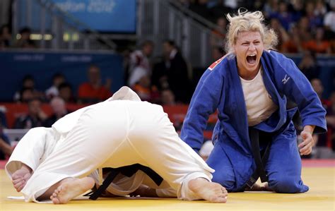 Kayla Harrison of the U.S. reacts after defeating Brazil's Mayra Aguiar ...