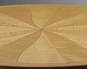 Round dining table in ripple sycamore | Makers' Eye