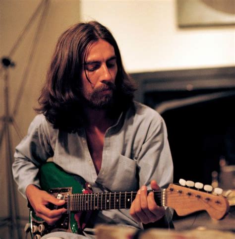 ♡♥George Harrison 26 plays an electric guitar at home in 1969 - click on pic to see a full scr ...