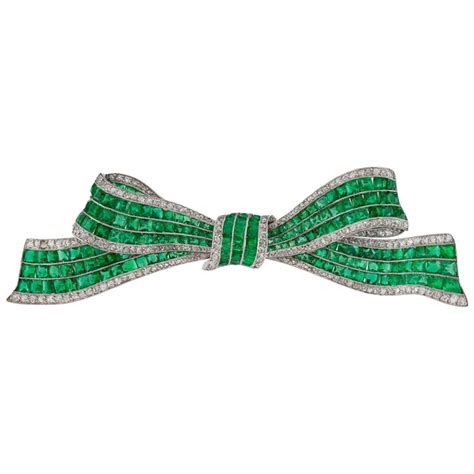 Art Deco Emerald and Diamond Bow Brooch at 1stDibs