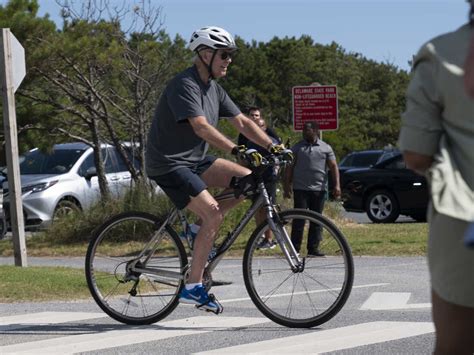 Biden falls while getting off his bike after a beach ride : NPR