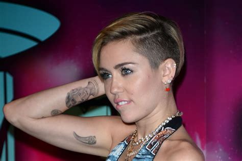 Miley Cyrus's Tattoos and Their Meanings | PS Beauty