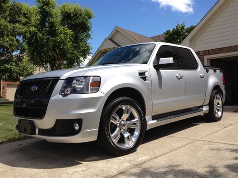 a white truck parked in front of a house