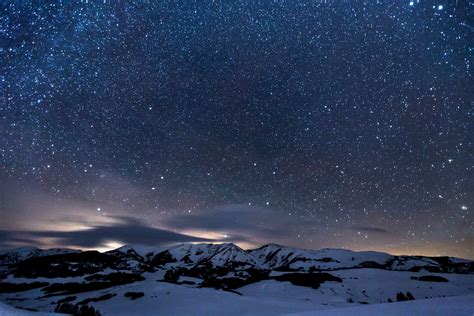 night sky with stars above snow landscape, landscape photo of mountain covered by snow during ...