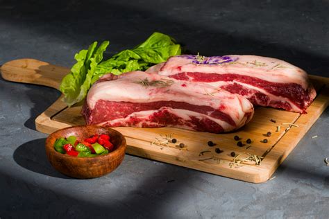 Raw Meat on Brown Wooden Chopping Board · Free Stock Photo