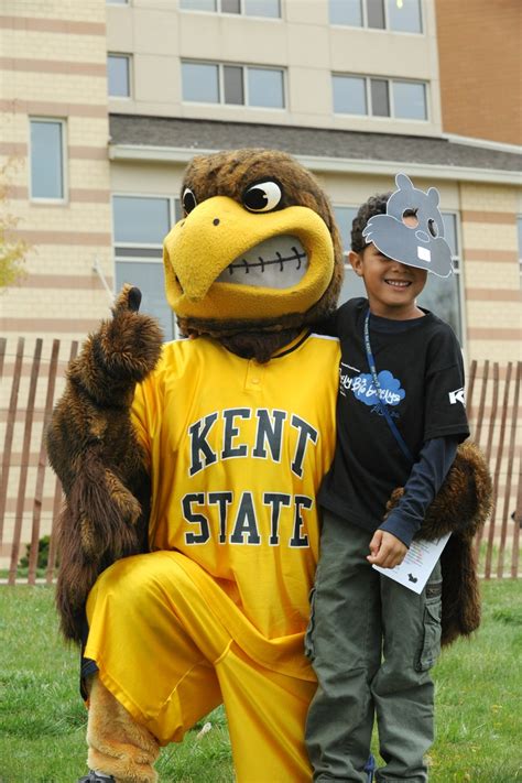 The little brother of a Kent State student poses with Flash, the ...