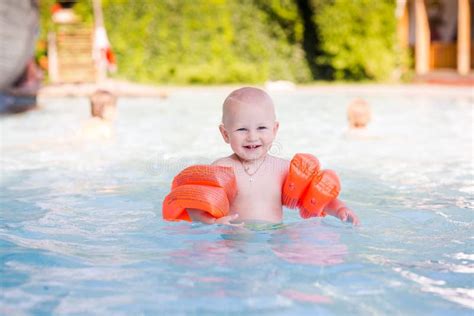 Cute Little Baby in Swimming Pool Stock Image - Image of blue, learning: 55819635