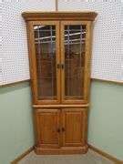 Oak 4 Door Leaded Beveled Glass Corner Cabinet - Oberman Auctions