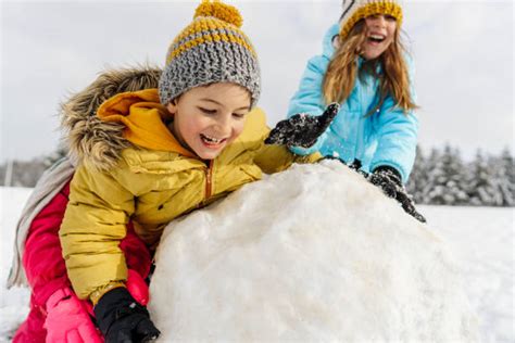 2,100+ Snowman Building Family Stock Photos, Pictures & Royalty-Free ...