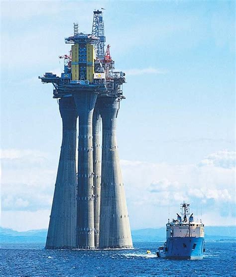 This is one of the largest oil rigs in the world being moved before it's partially submerged ...