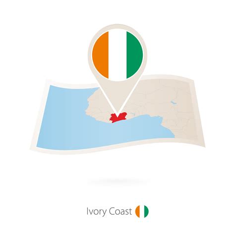 Folded paper map of Ivory Coast with flag pin of Ivory Coast. 36931902 ...